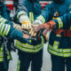A group of firefighters uniting together.