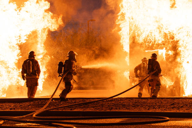 An image of firefighters extinguishing flames.